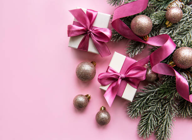 istock Christmas gifts, pink decorations on pastel pink background. 1284677746