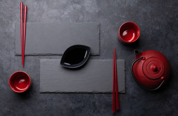 istock Stone plate and chopsticks for your sushi and maki 1284678906