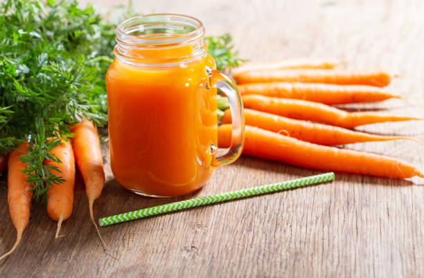 istock glass jar of fresh carrot juice 1284680219