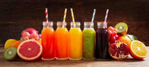 istock bottles of fruit juice with fresh fruits 1284680254