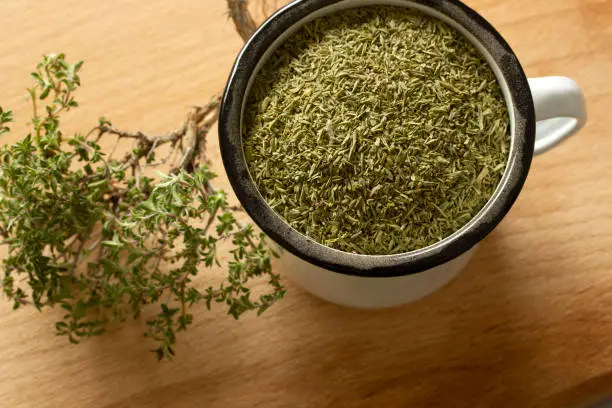 Photo of dried thyme on the table