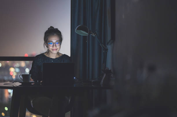 istock Tired overworked asian female feeling eye strain after using computer while working at home 1284681754