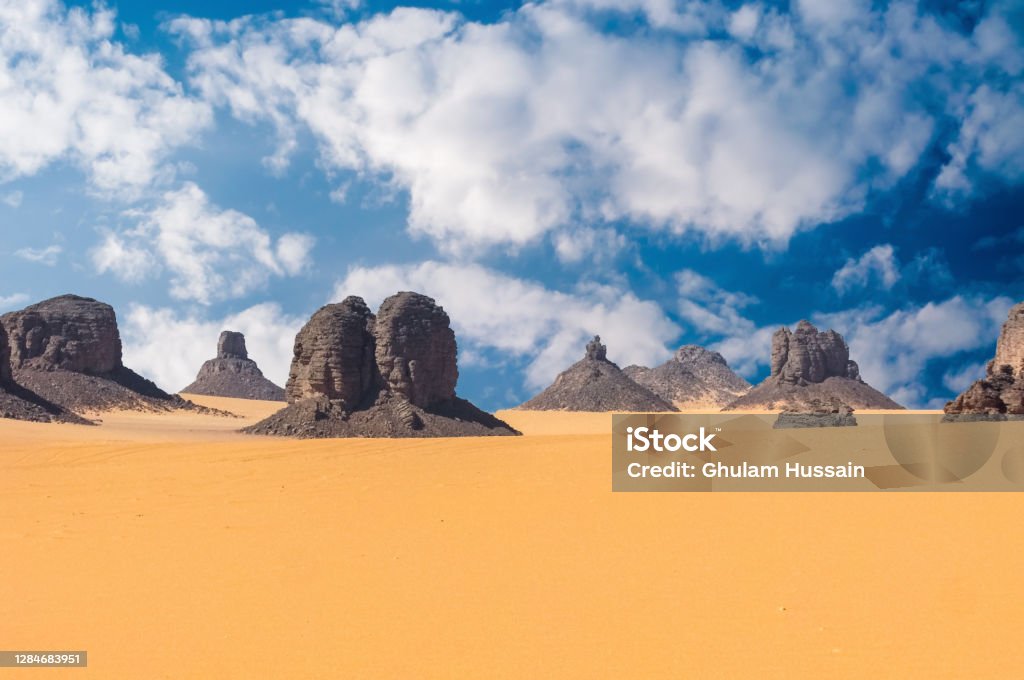 Rock formation in the Sahara desert Sand dunes and rocks near the Djanet in the Algeria Ennedi Mountains Stock Photo