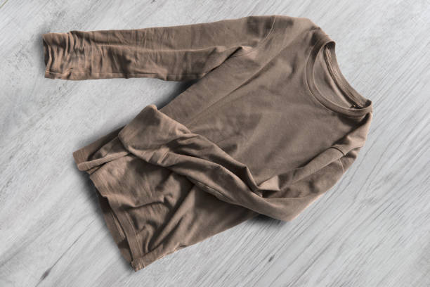 istock Shirt on wooden background 1284684232