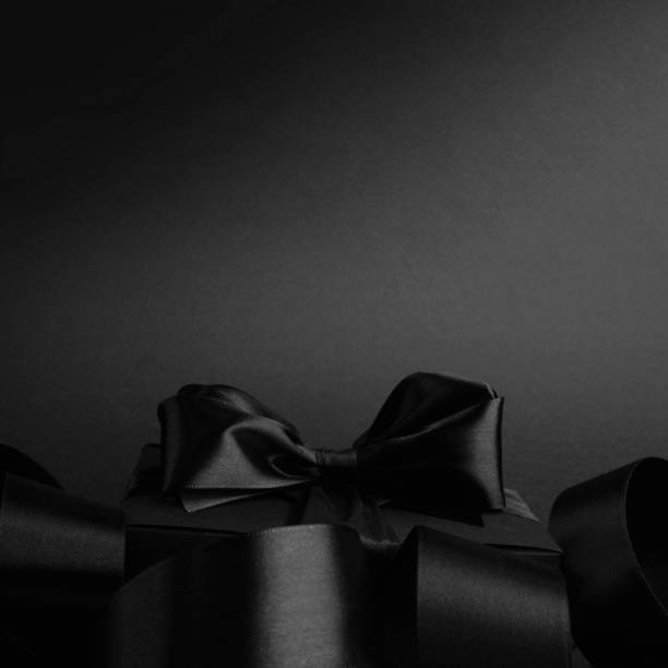 istock Black friday sale background with gift 1284685052