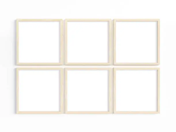 Mockup of six thin square wooden frames on a light wall. 3D illustration.