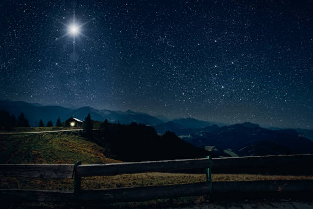 The star shines over the manger of christmas of Jesus Christ. stock photo