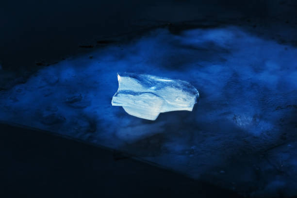 Beautiful white piece of ice Real beautiful white piece of ice in mysterious blue light in winter real life photos stock pictures, royalty-free photos & images