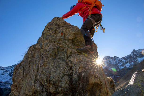 istock Mountaineer ascends mountain ridge crest 1284687289