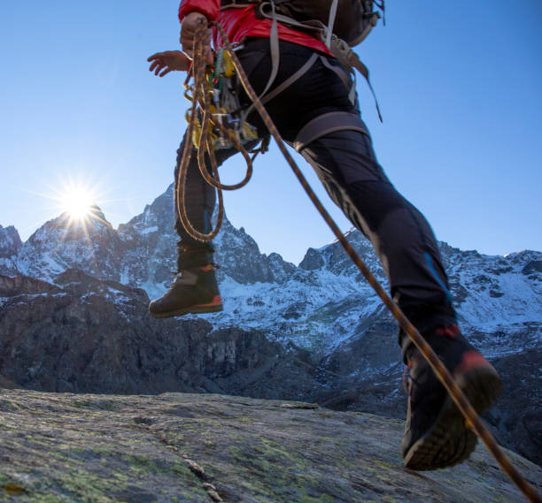 istock Mountaineer ascends mountain ridge crest 1284687290