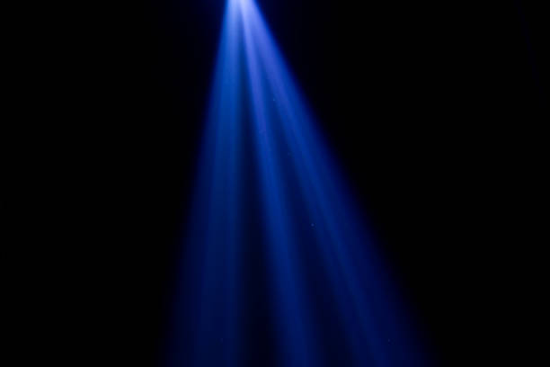istock blue beam illuminates the dark scene 1284688383