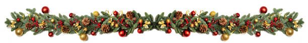 New Year and Christmas border design New Year and Christmas border design isolated on white background, fir tree branches ribbon bows golden and red decorative baubles and pine cones traditional design evergreen garland stock pictures, royalty-free photos & images