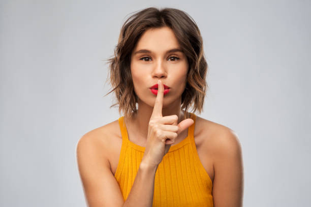 istock young woman in mustard yellow top 1284693324