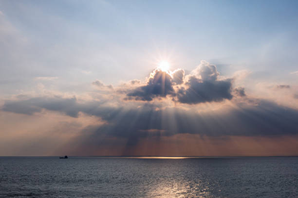istock Beautiful sun rays and the sea 1284700804