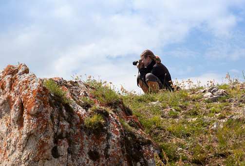 Olkhon, Russia-July 28, 2010: Tourists taking pictures in a way in Olkhon Islan in Baikal lake