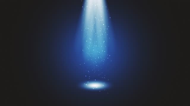 Stage light shining at blue studio. Big spotlight illuminate the scene from sky. Rays of lights on stage with glowing sparkles. All the lights gather in one point. The concepts of performance arts, party, lighting, event, celebration, UFO, teleportation