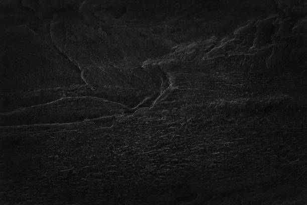 istock Dark grey black slate texture in natural pattern with high resolution for background and design art work. Black stone wall. 1284704285