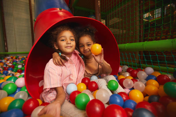istock Two girls playing together 1284705264