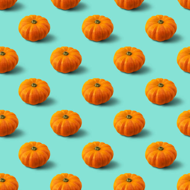 istock Seamless pattern with pumpkin on mint background. Autumn abstract background. Minimal vegetable concept. 1284705568