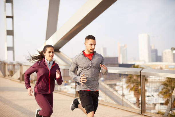 istock Two people running and exercising at the city. 1284706425