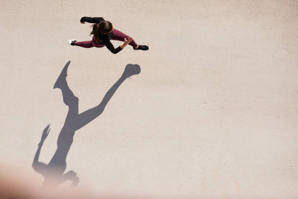 Top view of a woman running with copy space.