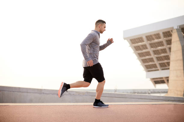 istock One man jogging in the city. 1284706665