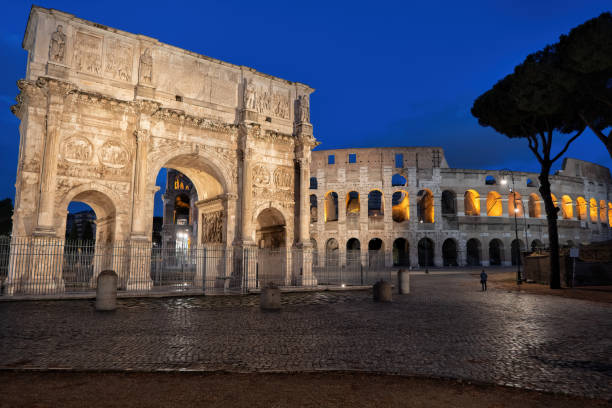 istock Arch of Constantine and Colosseum at Night 1284710211