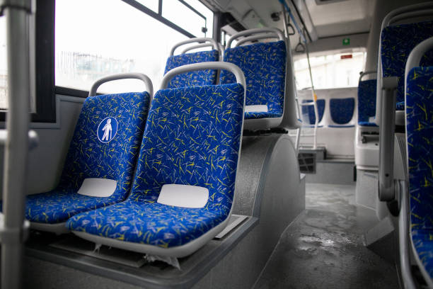 istock Empty bus interior. Blue seats without passengers. Public transport. Transportation of passengers by public transport. Ergonomic interior of the bus. Travel to other cities. 1284710474