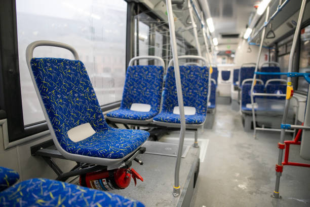 istock Empty bus interior. Blue seats without passengers. Public transport. Transportation of passengers by public transport. Ergonomic interior of the bus. Travel to other cities. 1284710536