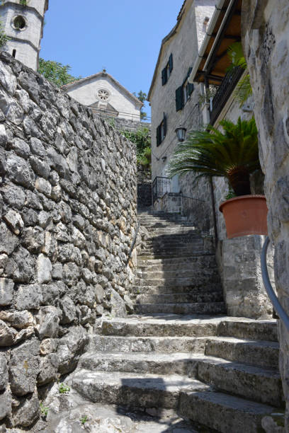 istock Narrow and steep street with stairs 1284710713