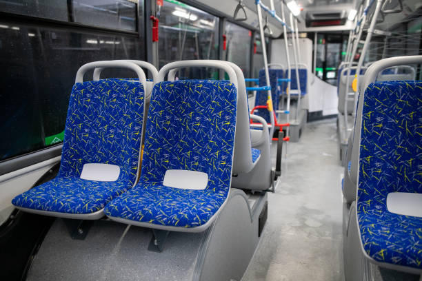 istock Empty bus interior. Blue seats without passengers. Public transport. Transportation of passengers by public transport. Ergonomic interior of the bus. Travel to other cities. 1284710745