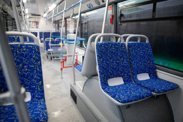 istock Empty bus interior. Blue seats without passengers. Public transport. Transportation of passengers by public transport. Ergonomic interior of the bus. Travel to other cities. 1284711414