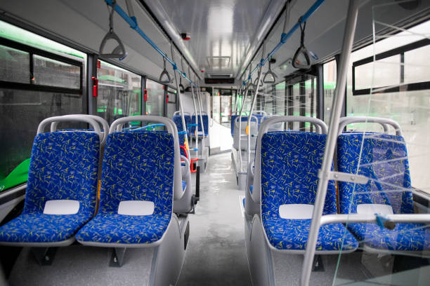 istock Empty bus interior. Blue seats without passengers. Public transport. Transportation of passengers by public transport. Ergonomic interior of the bus. Travel to other cities. 1284711478