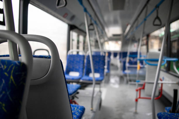 istock Empty bus interior. Blue seats without passengers. Public transport. Transportation of passengers by public transport. Ergonomic interior of the bus. Travel to other cities. 1284711488