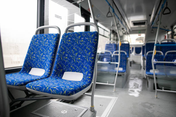 istock Empty bus interior. Blue seats without passengers. Public transport. Transportation of passengers by public transport. Ergonomic interior of the bus. Travel to other cities. 1284711505