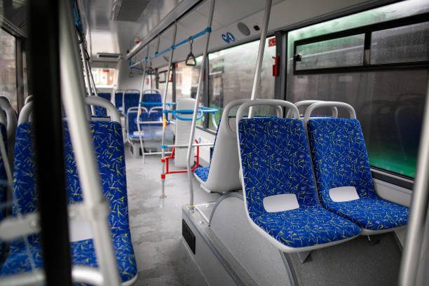 istock Empty bus interior. Blue seats without passengers. Public transport. Transportation of passengers by public transport. Ergonomic interior of the bus. Travel to other cities. 1284711517