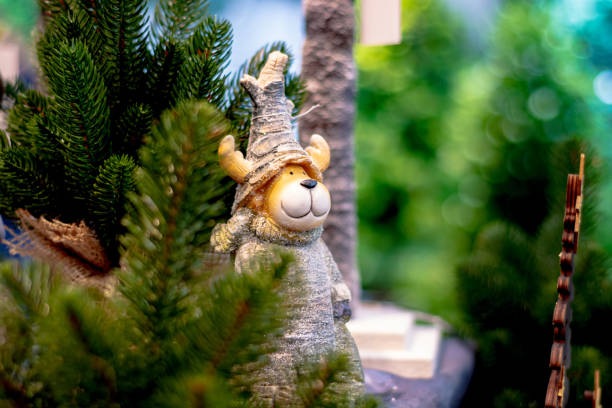 New Year's bear with antlers by the Christmas tree.