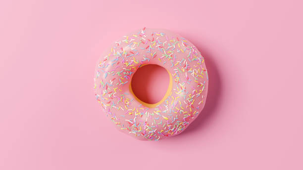 istock Pink Doughnut with white sprinkles in still life on pink background. Top view. 3D Illustration 1284713093