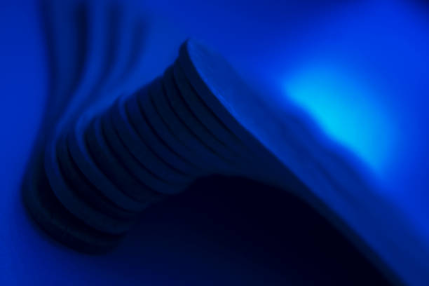 istock Curvy identical objects stacked on top of each other creating a juncture. 1284713973