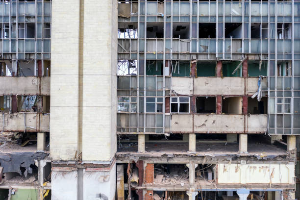 Close-up of a building made of steel and concrete being demolished.