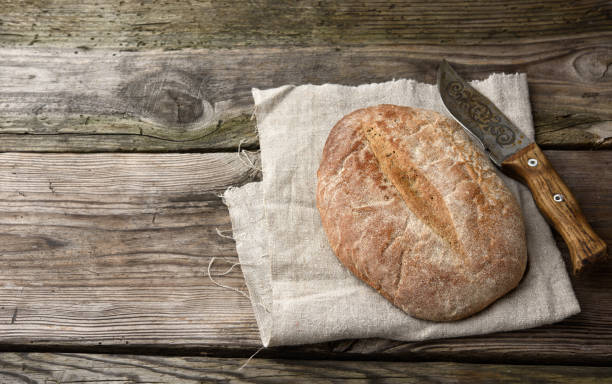 istock oval baked rye flour bread on gray linen napkin 1284715813