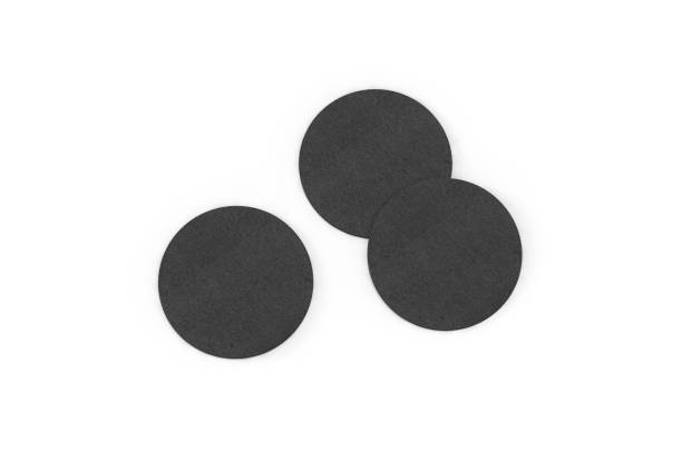 istock Blank black beer coaster mockup lying on white background, ready for your design presentation, 3d illustration 1284716680
