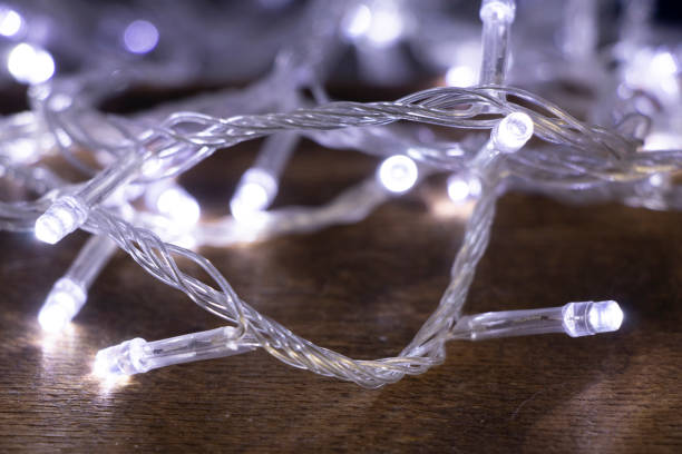 istock White lights lie on the table with flour after Christmas baking in a dark room. 1284716909