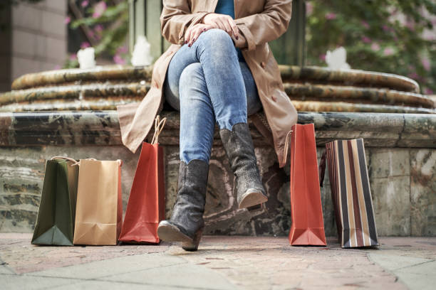 istock young asian woman taking a break during a shopping spree 1284717645