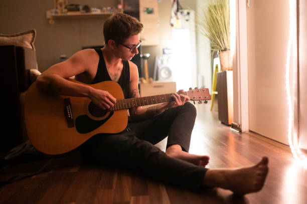 istock A Musician Playing An Acoustic Guitar 1284718946