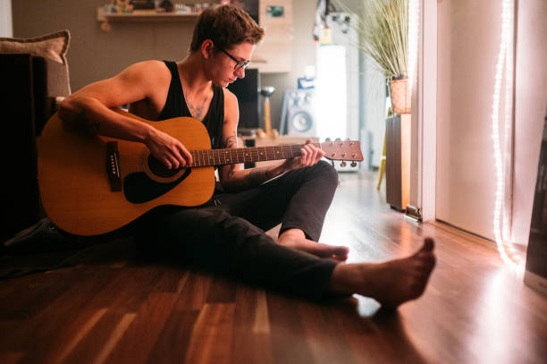 istock A Man Playing An Acoustic Guitar 1284719464