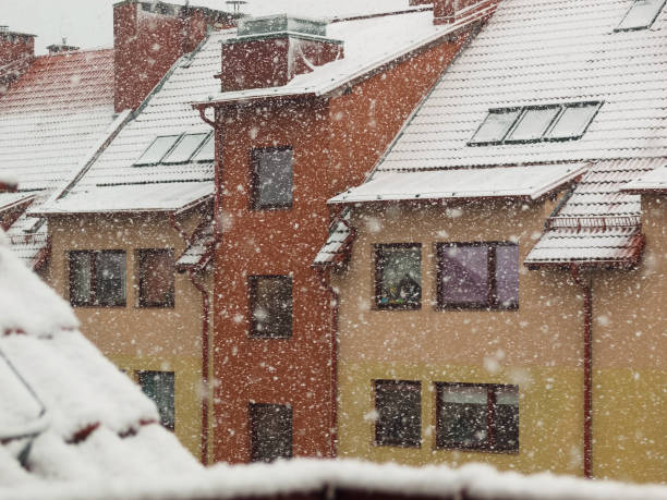 snowing on a city background. winter weather