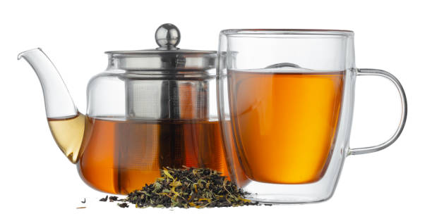 istock Glass teapot and glass cup with tea isolated on white 1284720919