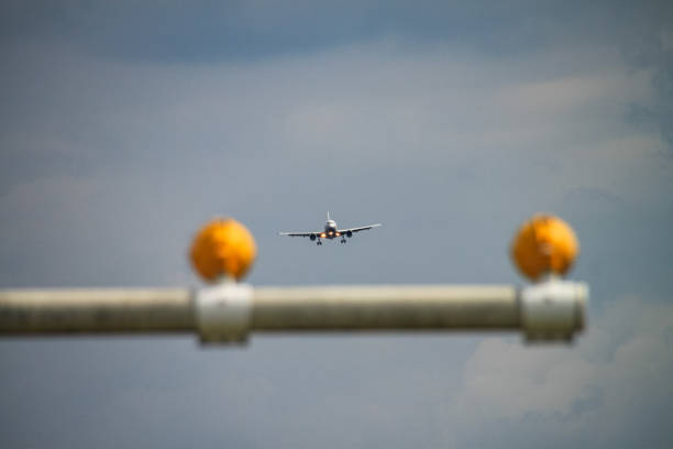 An airplane with the landing gear down on final approach