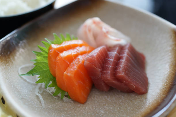 Sashimi on white plate, Tuna, Salmon, Yellow Tail. Top view